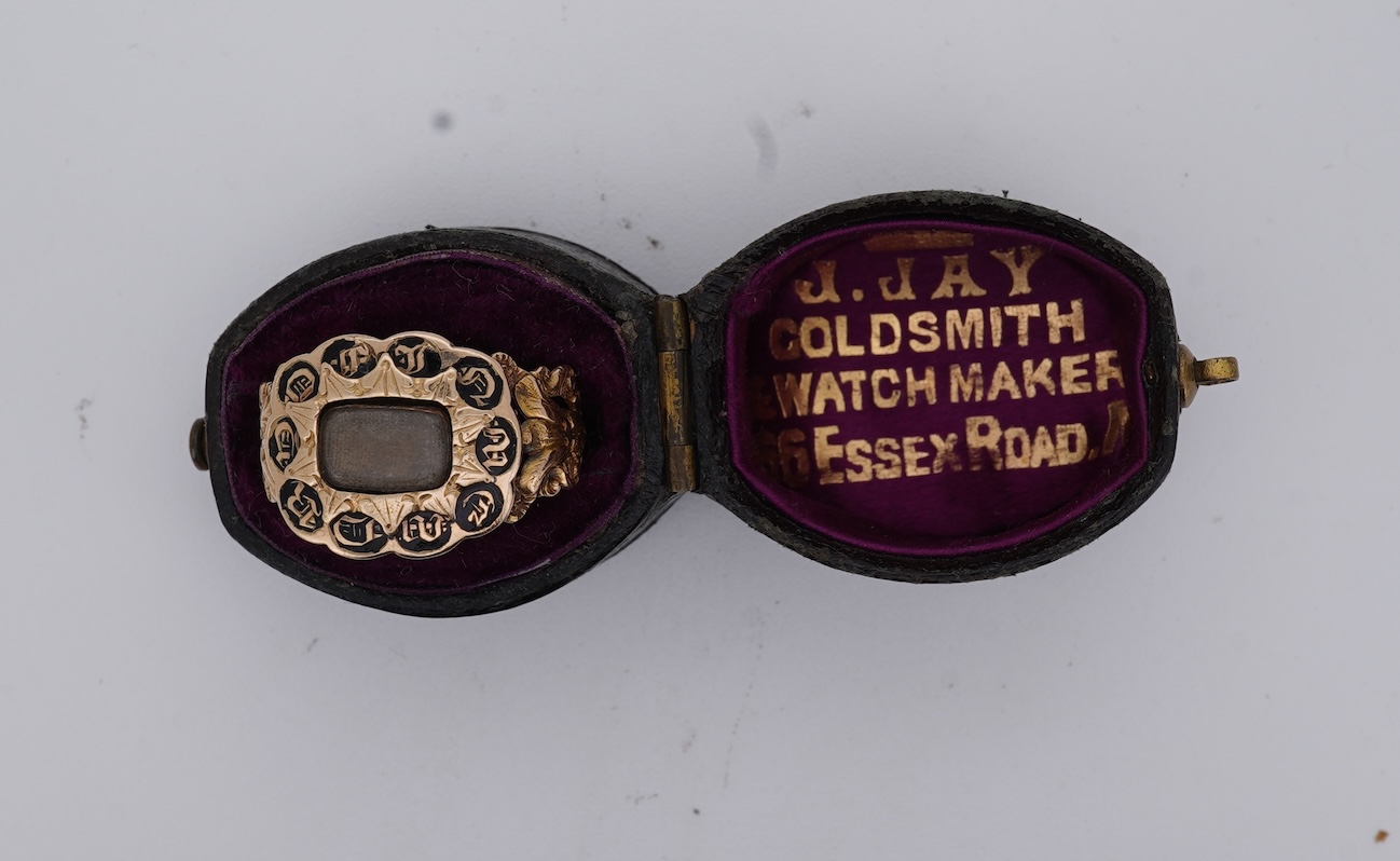 A William IV 18ct gold and black enamel 'In Memory' mourning ring, with hair beneath a central glazed panel, size N, gross weight 2.8 grams.